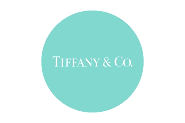 Logo circular minimalista en color turquesa con tipografía elegante en el centro